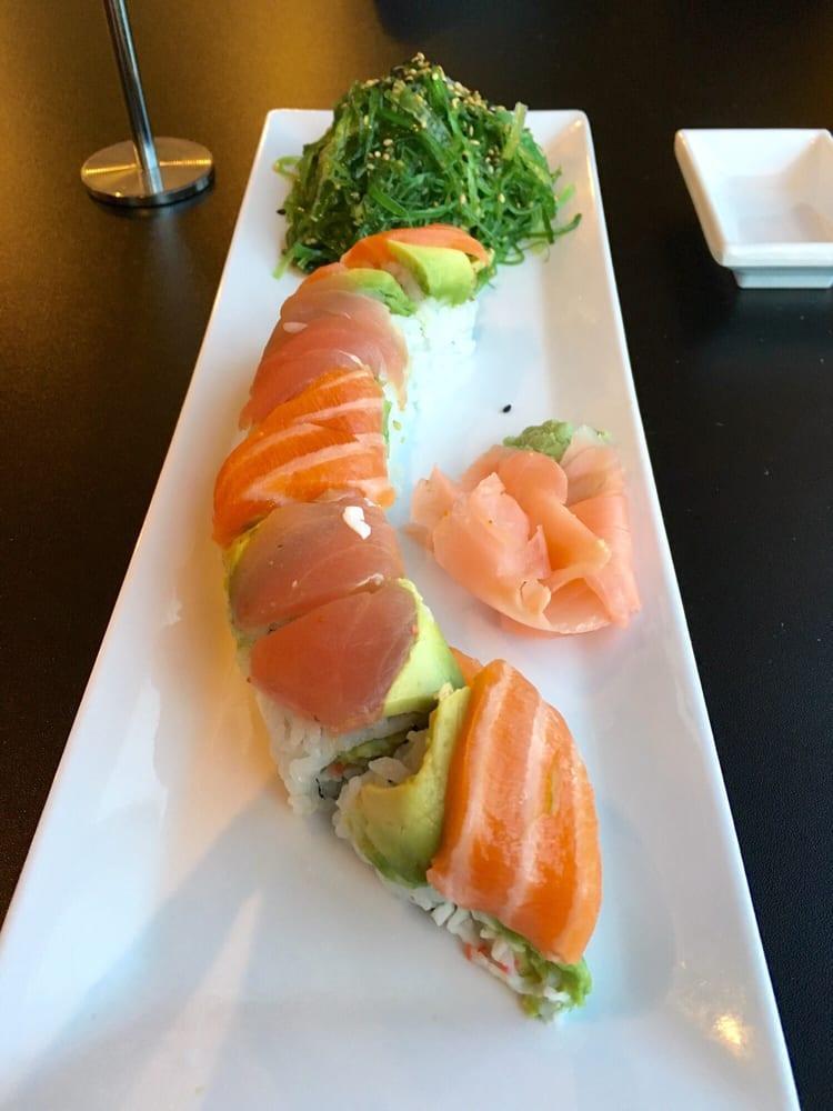 Rainbow Roll · Crab, avocado, cucumber on the inside and avocado and chef's choice of fish on the outside.