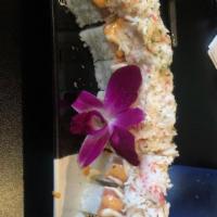 Fuji Mountain Roll · Tempura shrimp, shredded crab, cream cheese on the inside and smoked salmon, mango sauce, sp...