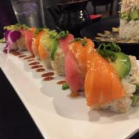 Thunder Roll · Inside: tempura asparagus and crab. Outside: avocado, chef choice fish and green onions.