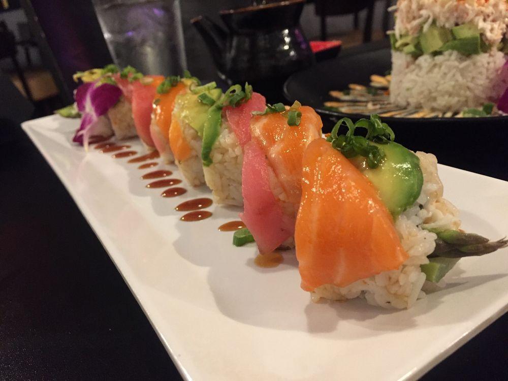 Thunder Roll · Inside: tempura asparagus and crab. Outside: avocado, chef choice fish and green onions.