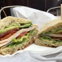 Chipotle Bacon Club Sandwich · Chipotle bacon, turkey, avocado, butter lettuce, tomatoes and homemade cilantro lime mayo on...