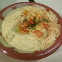 Spicy Hummus · Hummus mixed with a roasted chili sauce, drizzled with extra virgin olive oil. Vegetarian an...