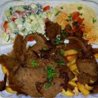 Gyro Plate · Gyro meat made with beef and lamb of the spit. Served with rice, salad, hummus & pita bread....