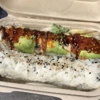 Dragon Roll · Tempura shrimp and crabmeat inside, topped with avocado, unagi, tobiko and sesame seed.