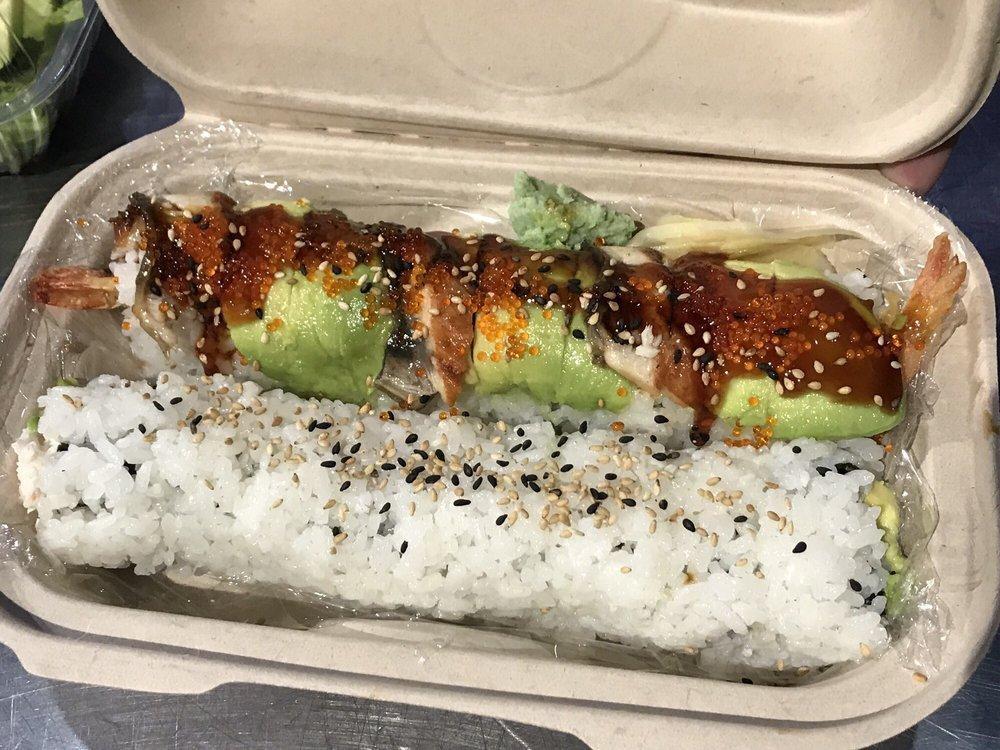 Dragon Roll · Tempura shrimp and crabmeat inside, topped with avocado, unagi, tobiko and sesame seed.