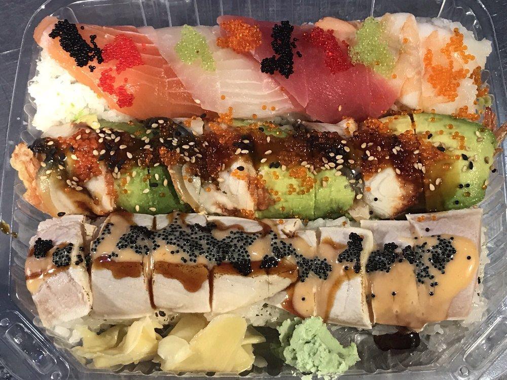 Rainbow Roll · Crabmeat and avocado inside, topped with assorted raw fish and mixed tobiko. 