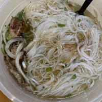 Grilled Chicken Pho · Served with rice noodle and chicken or beef broth topped with fresh green onions, cilantro, ...
