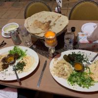Veggie Plate · 4 falafels, 4 dolmahs, hummus, tabbouleh and baba ghanoush.