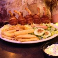 Steak and Bacon Wrapped Shrimp · Topped with 3 bacon wrapped shrimps.  Served with fries and salad.