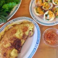 Banh Xeo · Mung bean crepe with shrimps, pork and bean sprouts and fresh greens.