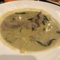 Green Curry · Creamy coconut milk with green curry, bamboo shoots, chili and basil leaves.