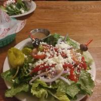Greek Salad · Our most popular salad; fresh romaine, tomatoes, onions, pepperoncini, sliced pimento, kalam...