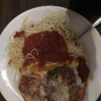 Eggplant Parmigiana · Crisp fried eggplant simmered in marinara and served over pasta with melted mozzarella