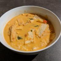 Red Curry · Red curry paste in coconut milk soup, bell peppers, eggplants, bamboo shoots and basil serve...