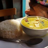 Green Curry · Green curry paste in coconut milk soup, bell peppers, eggplants, bamboo shoots and basil ser...