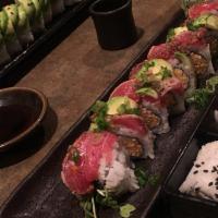 Red Dragon Roll · Spicy krab, cucumber, sprouts, layered with peppered seared tuna, avocado, green onions, swe...