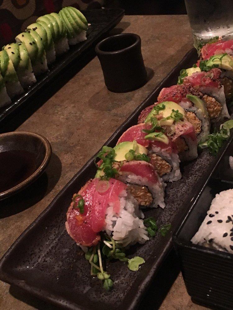 Red Dragon Roll · Spicy krab, cucumber, sprouts, layered with peppered seared tuna, avocado, green onions, sweet and spicy ponzu.