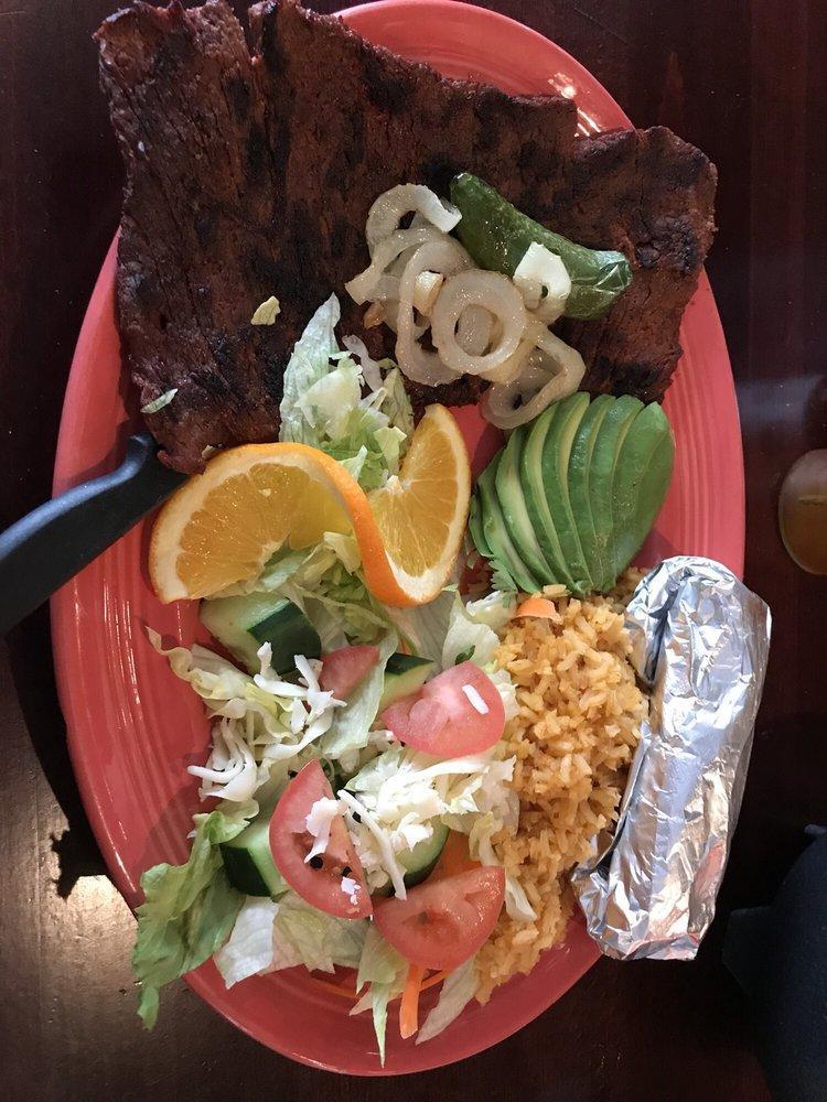 Carne Asada · A 10 oz. skirt steak char grilled to perfection topped with grilled onions, guacamole and pico de gallo