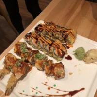 Dragon Fire Maki · 8 pieces. Shrimp tempura, cream cheese, topped with salmon and white tuna, broiled with spic...