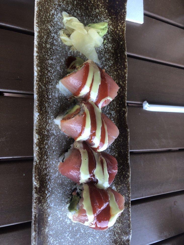 Lava Roll · Spicy tuna, avocado, tempura crunch, wrapped with tuna, wasabi mayo, sweet chili sauce. Spicy.