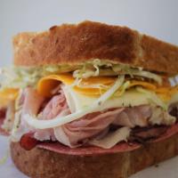 The Machete Sandwich · Over a half pound of turkey, pastrami, ham, salami, cheddar cheese, provolone cheese, mayo, ...