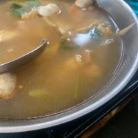 Tom Yum · Spicy and sour soup with choice of meat, mushrooms, lemon grass, chili and lime juice. 