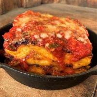 Lasagna · Parmesan bechamel, mozzarella, Bolognese sauce.