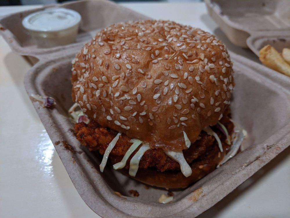 Nashville Hot Sandwich · Hot and spicy crispy Nashville chicken, served with creamy coleslaw and dill pickles.