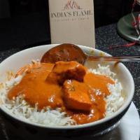 Chicken Tikka Masala · Marinated boneless white meat cooked in a tandoor in a special tomato ginger and cream sauce.