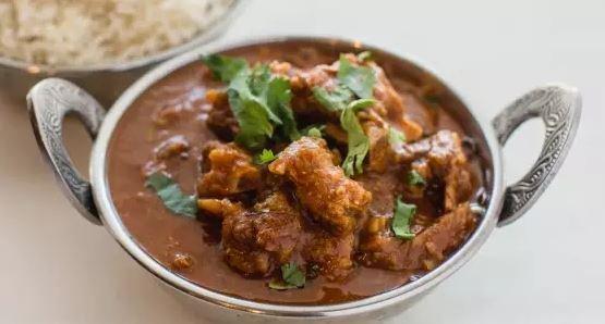 Goat Curry · Pieces of goat on the bone cooked in a delicately spiced onion based sauce.