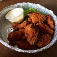 Buffalo Wings · 8 pieces. Cooked wing of a chicken coated in sauce or seasoning. Mild or hot with blue chees...