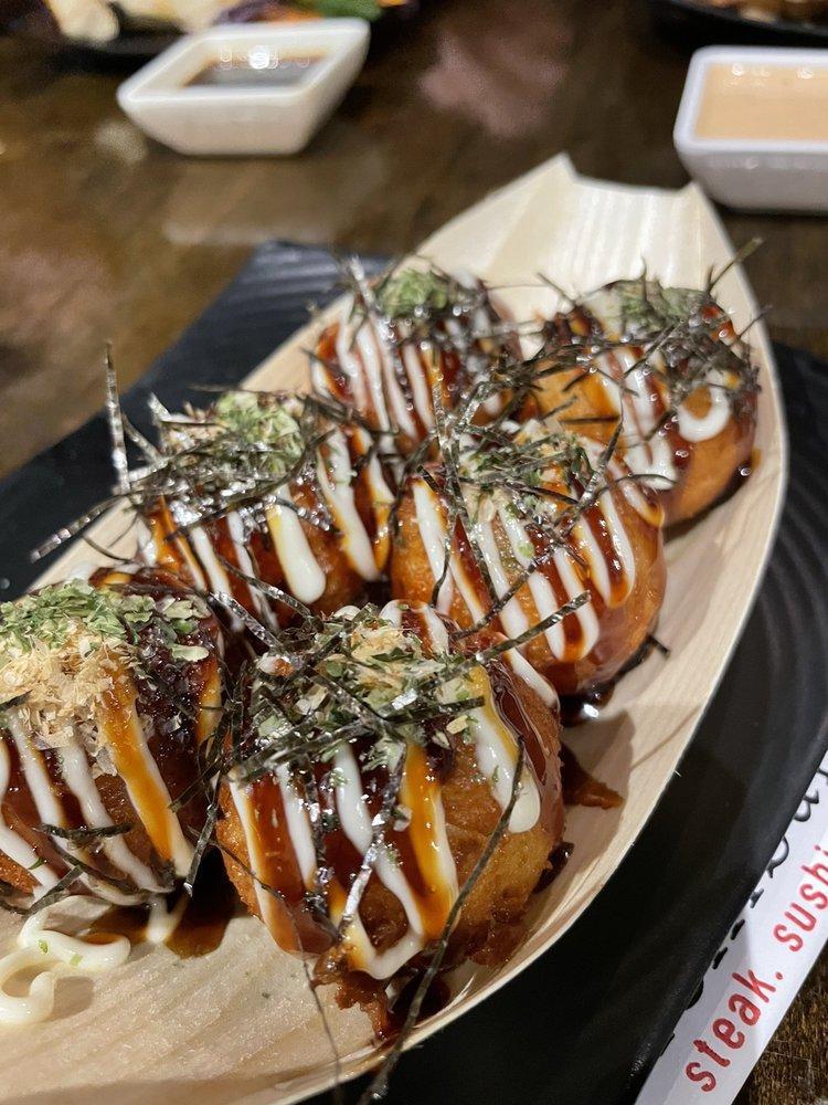 Takoyaki · Japanese fried batter filled with octopus topped with Japanese mayo eel sauce, blue nori  and bonito flakes.