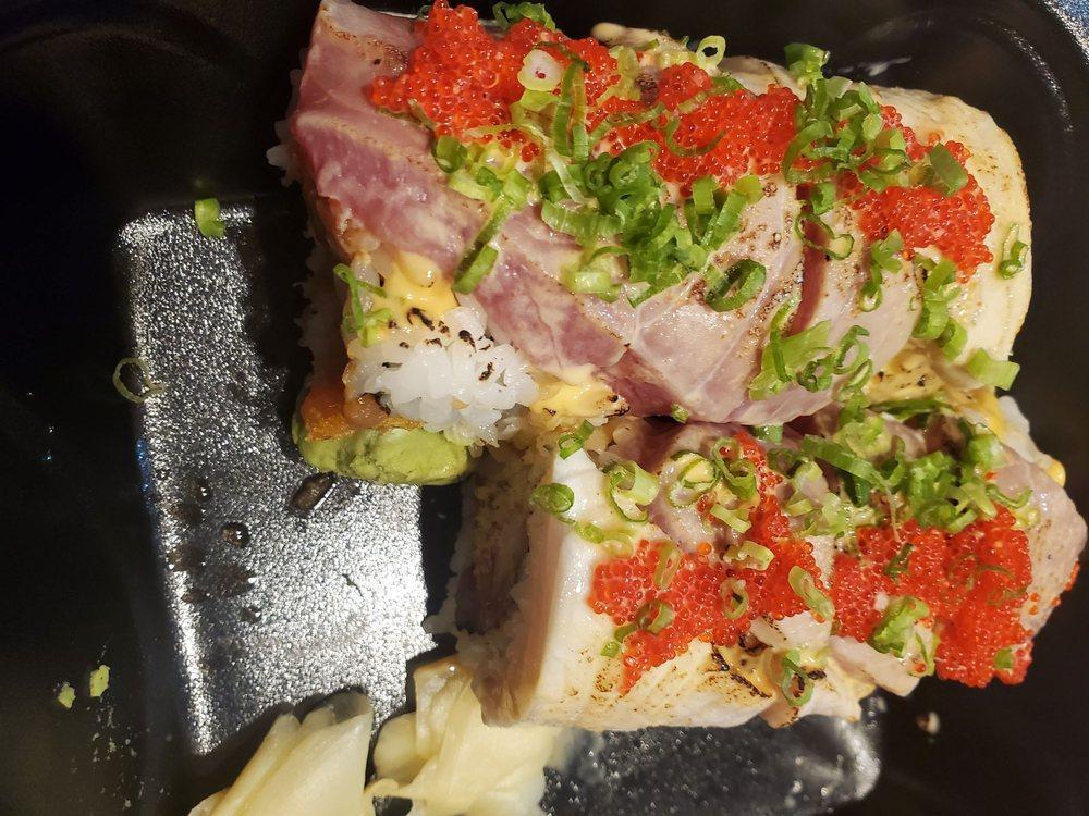 5 Season Roll · Spicy tuna, kanikama and tempura flakes topped with seared tuna, yellowtail, garnished with tobiko and scallions then served with ponzu sauce.