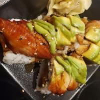 Empress Roll · Spicy tuna, spicy yellowtail and cucumber topped with eel, avocado and kabayaki sauce. Spicy.