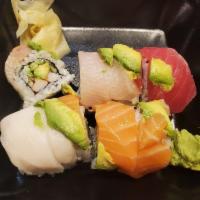 Over the Rainbow Roll · Fresh salmon, mango and cucumber topped with escolar, avocado, wasabi lime, kabayaki sauce a...