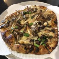 Umami Bomb Pizza · Roasted wild mushrooms, cippolini onions, garlic, fresh herbs, mushroom bolognese, fontina.