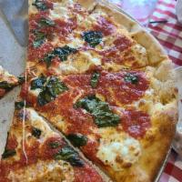 Margherita Pizza · Traditional pizza with extra famous sauce and fresh basil.