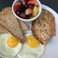 Traditional Breakfast · 2 open range eggs any style, all natural bacon, whole grain toast and house jam.