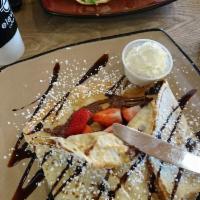 Nutella Crepe · Whipped cream and chocolate sauce optional.