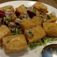 Salt and Pepper Fried Tofu · Cooked in oil. Bean curd made from soybeans.