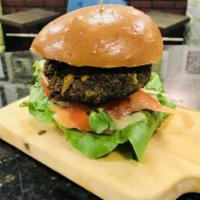 Veggie Burger · Homemade veggie burger ( Vegan) served on brioche bun with tomato, shredded carrot, micro-gr...