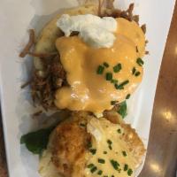 Chicken St Charles · Fried chicken over a buttermilk biscuit, topped with two poached eggs and finished with pork...