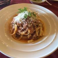 Lasagna Della Nonna · Traditional Italian lasagna layered with ground beef, mozzarella, bachamel and tomato sauce.