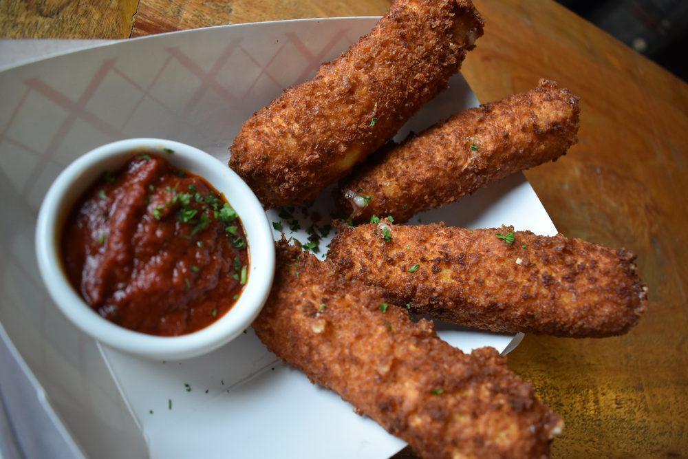 Brooklyn Mozzarella Logs · Perfect for sharing, or to enjoy all by yourself! Served with our signature Italian red sauce for dipping.