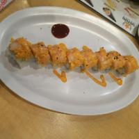 Flaming Joy Roll · Eight pieces. Deep fried shrimp tempura, cucumber, avocado, spicy crab and cooked shrimp on ...