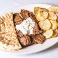 Souvlaki Plate · Chunks of sirloin steak, tzatziki sauce, feta cheese, Greek salad, Greek potatoes and pita b...