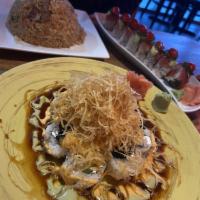 Volcano Roll · California Roll topped with scallops, crawfish, and tobiko, baked in spicy mayonnaise, eel s...