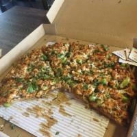 Butter Chicken Pizza · Masala Marinated Chicken, Red Onions, Bell Peppers, Mushrooms, Garlic with Creamy Curry Butt...