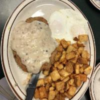 Country Fried Steak · A hand battered country fried steak, topped with grandma's country gravy and served with two...