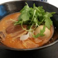 Spicy Miso Ramen · 8-hour pork belly, 12- hour tonkotsu broth w red chillies, tamago, cabbage, baby arugula bea...
